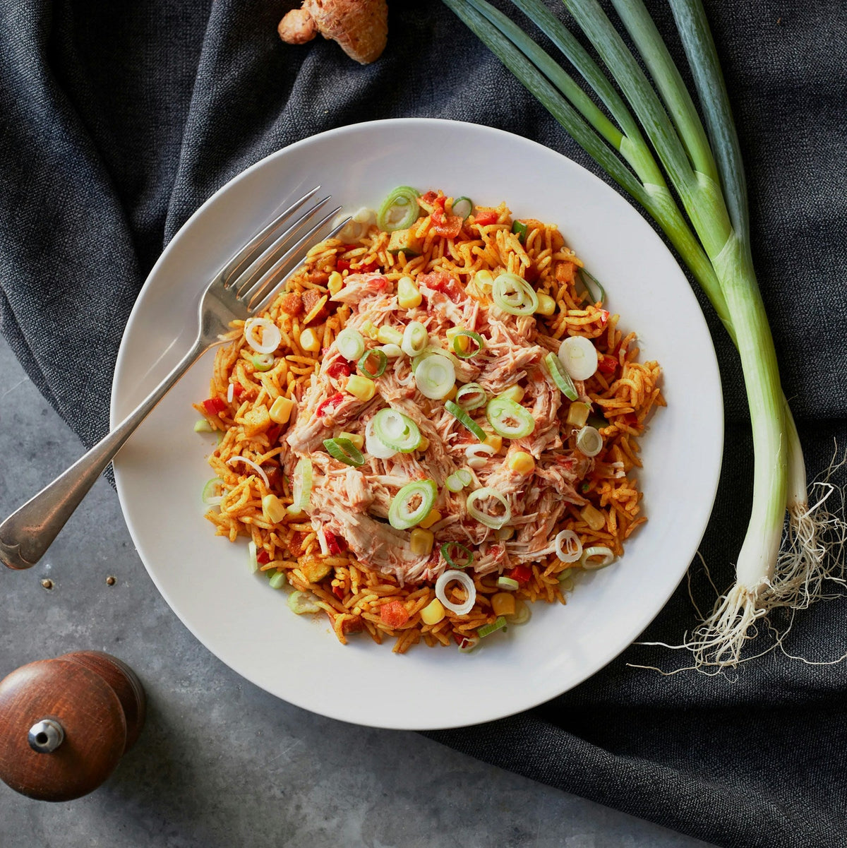 Illustrative chicken and rice meal; photograph by Andrew Relf on Unsplash